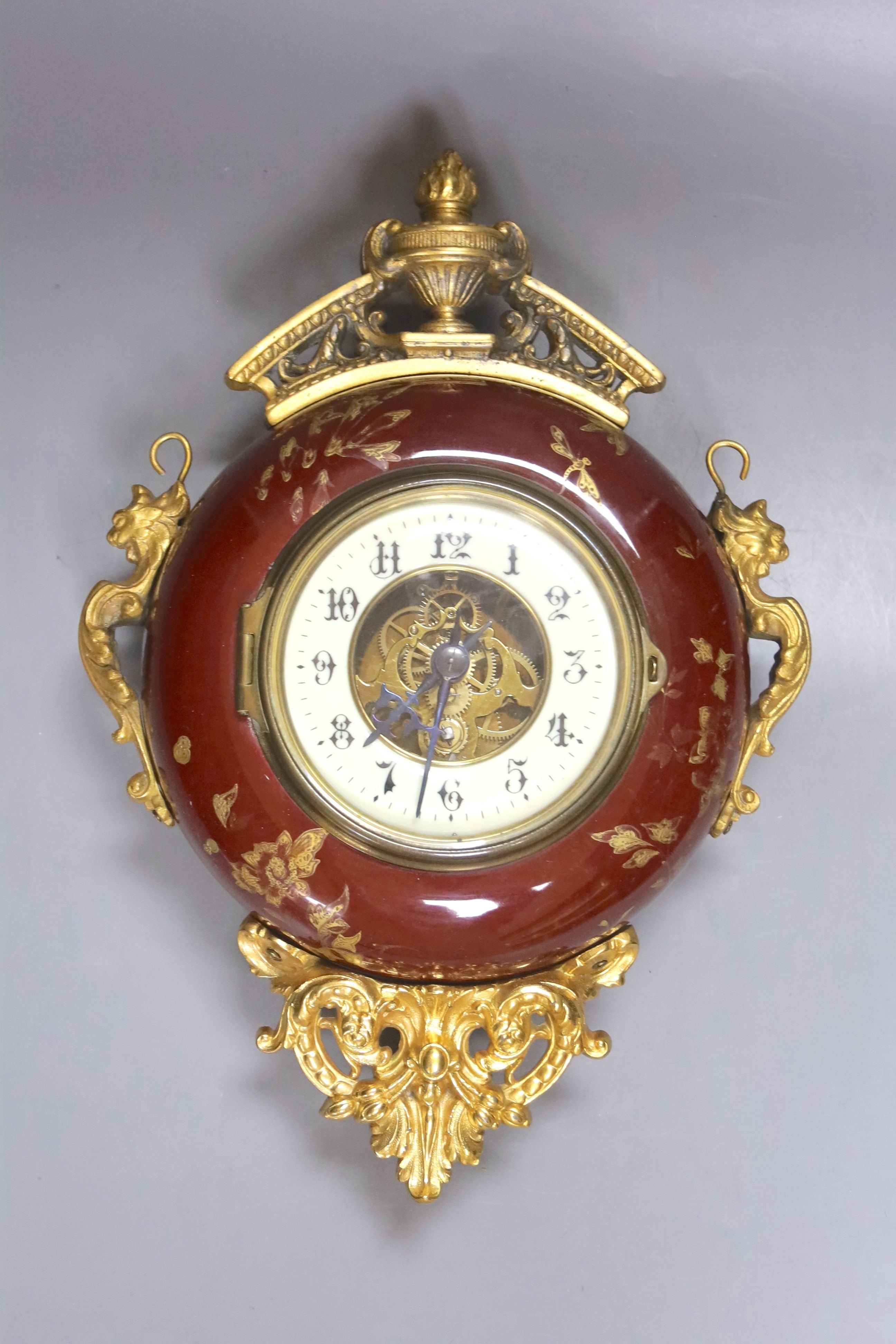 A French pottery and gilt metal cartel timepiece, height 38cm